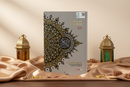 Compact A5 size Maqdis Al-Quran Al Kareem displaying original Arabic text with direct word-by-word English translation underneath and side margins showing Muhsin Khan translation.