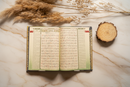 Maqdis Al-Quran Al Kareem A4 size with black cover, featuring word-by-word English and Arabic translation and color-coded Tajweed rules
